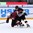 ZUG, SWITZERLAND - APRIL 23: Latvia's Kristaps Zile #7 gets tangled up with the German defender while attempting to play the puck during relegation round action at the 2015 IIHF Ice Hockey U18 World Championship. (Photo by Francois Laplante/HHOF-IIHF Images)